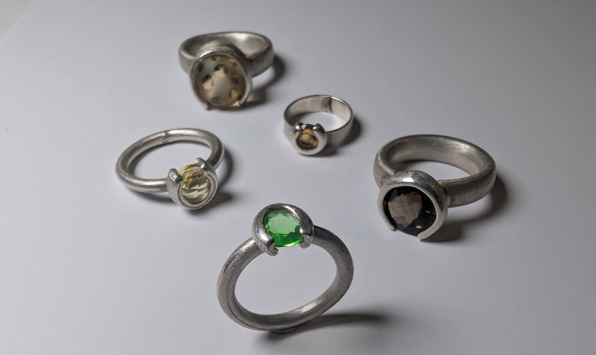 Silver rings with quarter setting