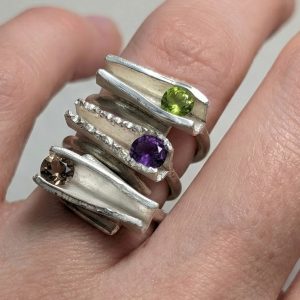 Three rings with ship-form setting rings